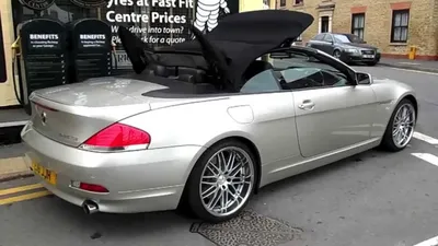 Car, BMW 645 CI Convertible, model year 2004-, gray/anthracite, closed top,  standing, upholding, frontal view, City, photographe Stock Photo - Alamy