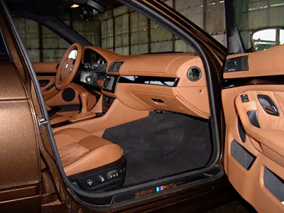 Перетяжка потолка, сидений и дверных карт BMW 7 в автоателье Grand Design в  Москве