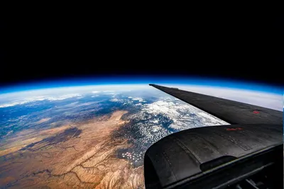 Вид из кабины самолета с высоты» — создано в Шедевруме