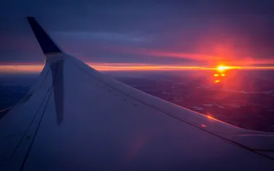 Вид на облака из окна самолета | Обои для телефона