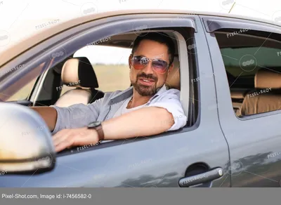 Красивый мужчина за рулем современного автомобиля :: Стоковая фотография ::  Pixel-Shot Studio