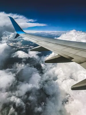 Небо. Облака. Земля с высоты. Виды из окна самолёта. Полёт. Поля облаков.  Photos | Adobe Stock