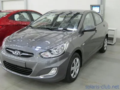 Фото Hyundai Solaris оранжевого (Sunset Orange) цвета кузова