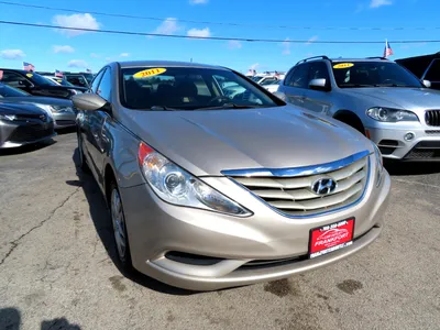 I'm trying my best to turn this 2011 Hyundai Sonata into something fun and  interesting. (So far, I've painted the wheels and hubcaps black, and I  attempted to match the front bumper,