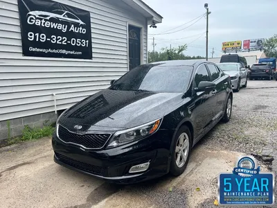 Eye-Catching Black Debadged Kia Optima with Red Accents — CARiD.com Gallery