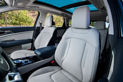 Kia Sportage 2024 - фото в новом кузове: салон, вид снаружи, багажник