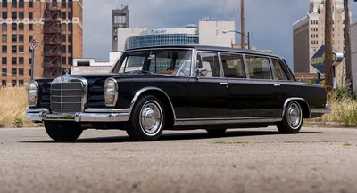 A mercedes benz 600 grosser with lowered suspesion and a widebody kit on  Craiyon