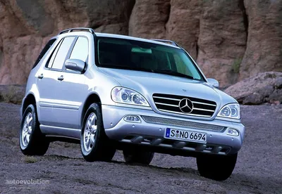 Mercedes ML 350, model year 2005-, silver, driving, diagonal from the back,  rear view, offroad Stock Photo - Alamy