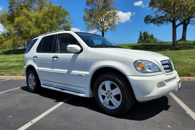 Car, Mercedes ML 320 CDI, model year 2005-, silver, cross country vehicle,  driving, diagonal from the back, rear view, side view Stock Photo - Alamy