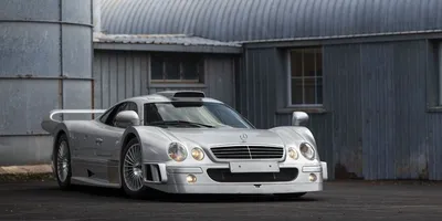A mercedes clk gtr modified as a racecar with racecar modifications and  decals on Craiyon