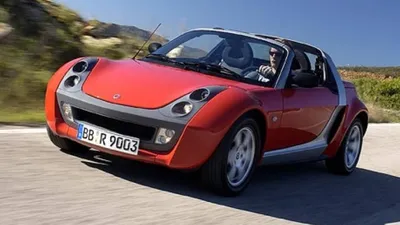 Rear and side views of the Little Lilac car driving on the road. The Smart  Roadster is a two-door sports car made by the German company Mercedes-Benz  Stock Photo - Alamy
