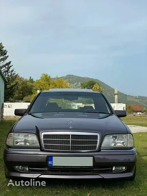 Goleniow, Poland - April 20th, 2021: Old black tuned Mercedes Benz C-class ( W202 model) near forest. Compact luxury sedan icon from the 90s. Side view  Stock Photo | Adobe Stock
