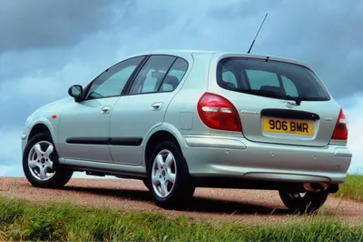 A synthwave style picture of a silver nissan almera hatchback 2001 on  Craiyon