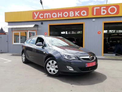 Купить бу Opel Astra 1.6 AT (180 л.с.) 2011 года с пробегом в Москве —  автосалон «Автоградъ»