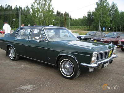 The front view of an old rusty Opel Diplomat classic car. - SuperStock