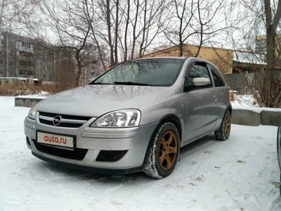 Car, Opel Corsa 1.3 CDTI, small approx., Limousine, model year 2003-,  silver, driving, diagonal from the back, rear view, countr Stock Photo -  Alamy