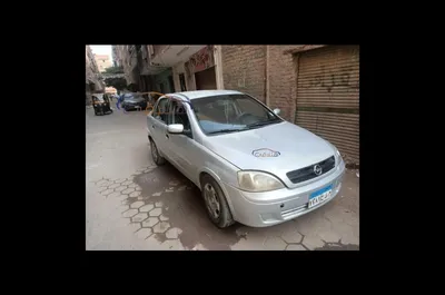 Car, Opel Corsa 1.3 CDTI, small approx., Limousine, model year 2003-,  silver, driving, diagonal from the front, frontal view, co Stock Photo -  Alamy