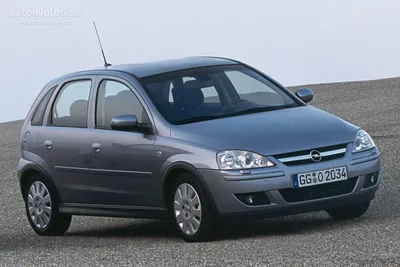 Car, Opel Corsa, model year 2000-2003, silver, Limousine, small approx.,  side view, driving Stock Photo - Alamy