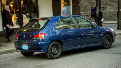 Foreign hatchback spotted on the street of Montreal, Canada: diplomatic Peugeot  306