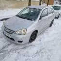 Серебристый Suzuki Liana 2004 года с пробегом по цене 350 000 руб. в  Новосибирске