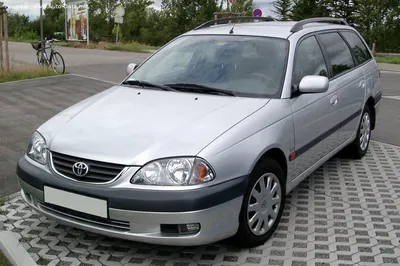 Toyota Avensis Combi 2.0 D-4D Executive, model year 2006-, silver, driving,  diagonal from the back, rear view, City Stock Photo - Alamy