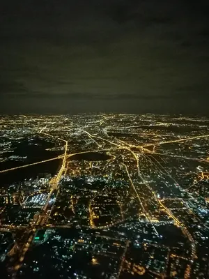 Вид из самолёта на ночной город…» — создано в Шедевруме