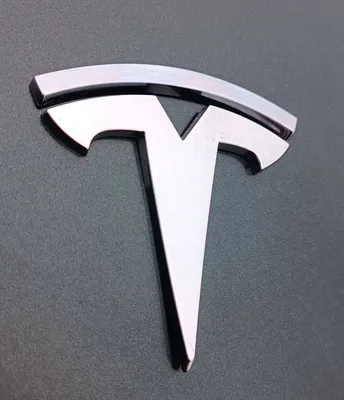 101636500 Эмблема значок \"T\" крышки багажника (шильдик) Tesla Model S 2019  1016365-00 купить бу в Новосибирске по цене 5210 руб. Z34663148 - iZAP24